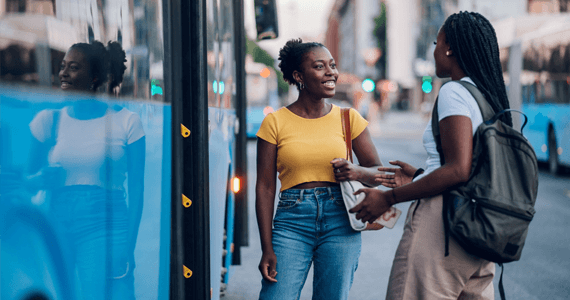 passengers happily boarding a bus